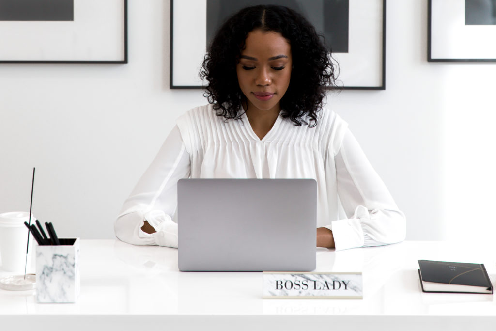 successful women entrepreneur - a female entrepreneur working on her laptop