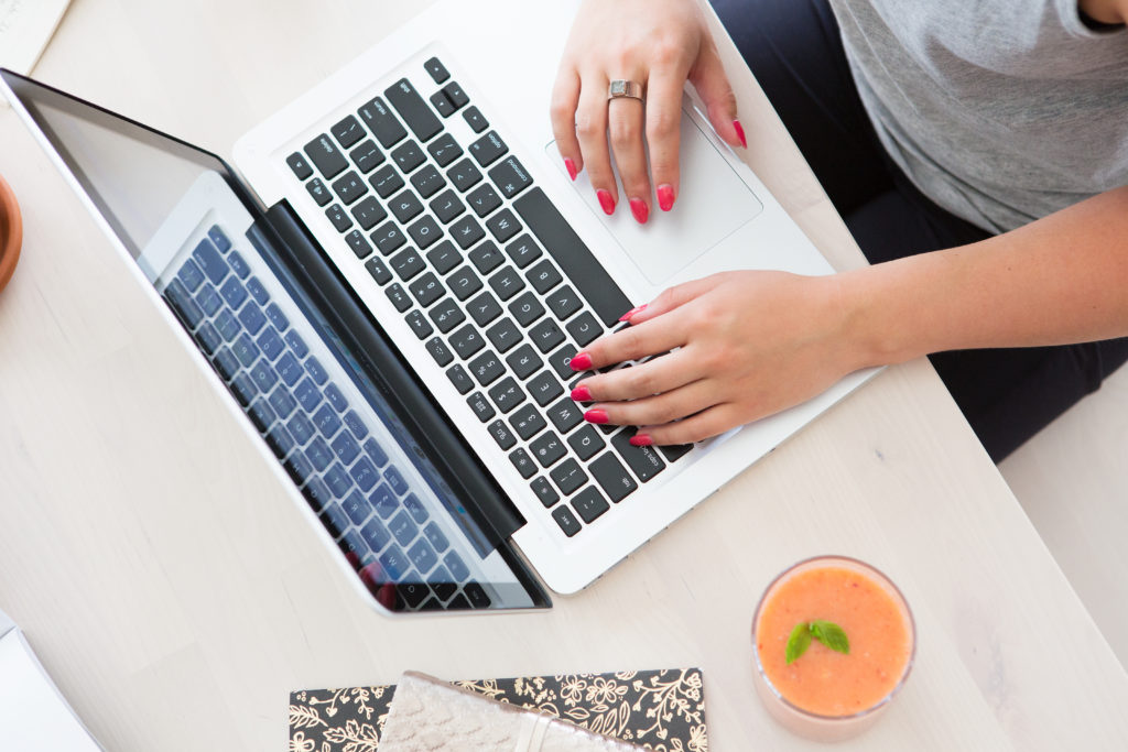 corona virus business impact: a woman working on a Macbook